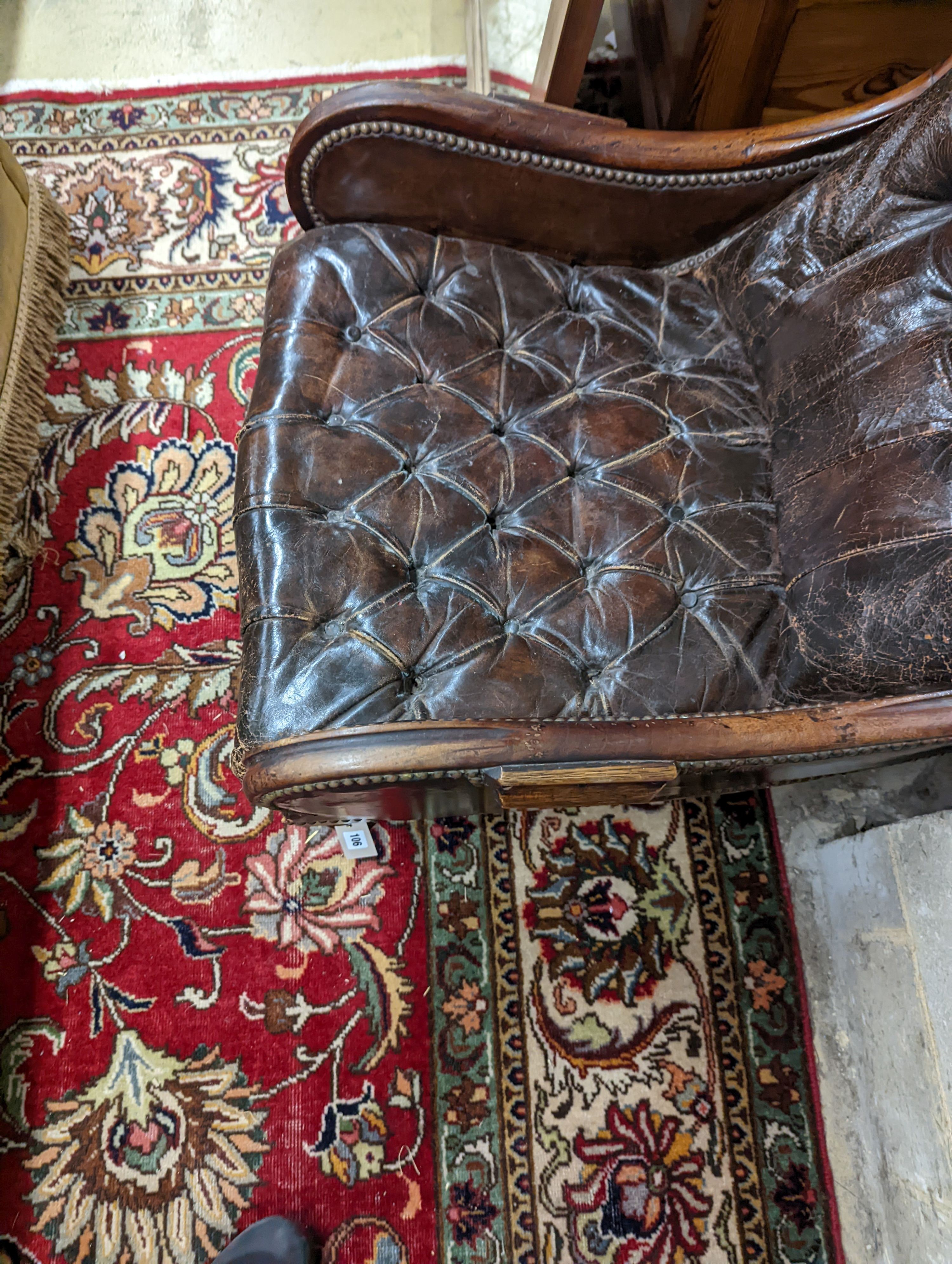 A late 19th century leather button back chair. H-90cm.